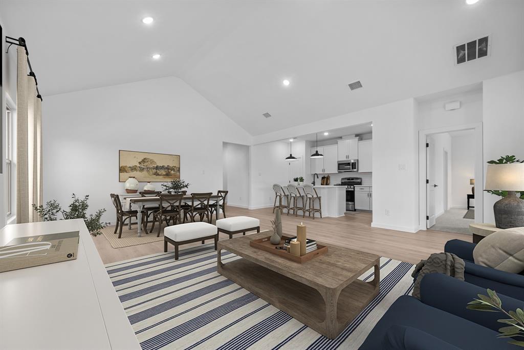 2209 Maple Ridge Drive Van Alstyne, TX 75495 - Photo 12 of 22 a living room with furniture and a table