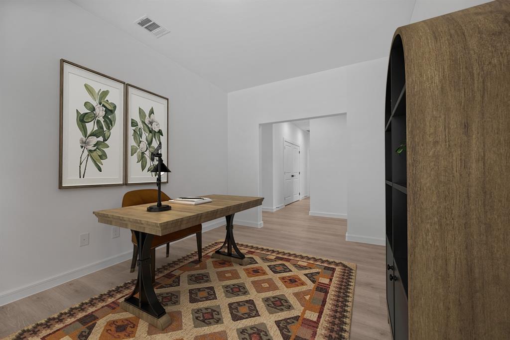 2209 Maple Ridge Drive Van Alstyne, TX 75495 - Photo 16 of 22 a view of a room that has a table and a chair in it