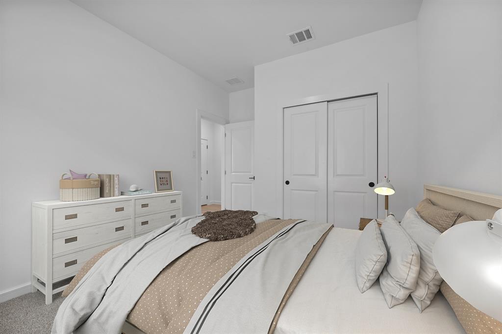 2209 Maple Ridge Drive Van Alstyne, TX 75495 - Photo 19 of 22 a bedroom with a bed and lamp