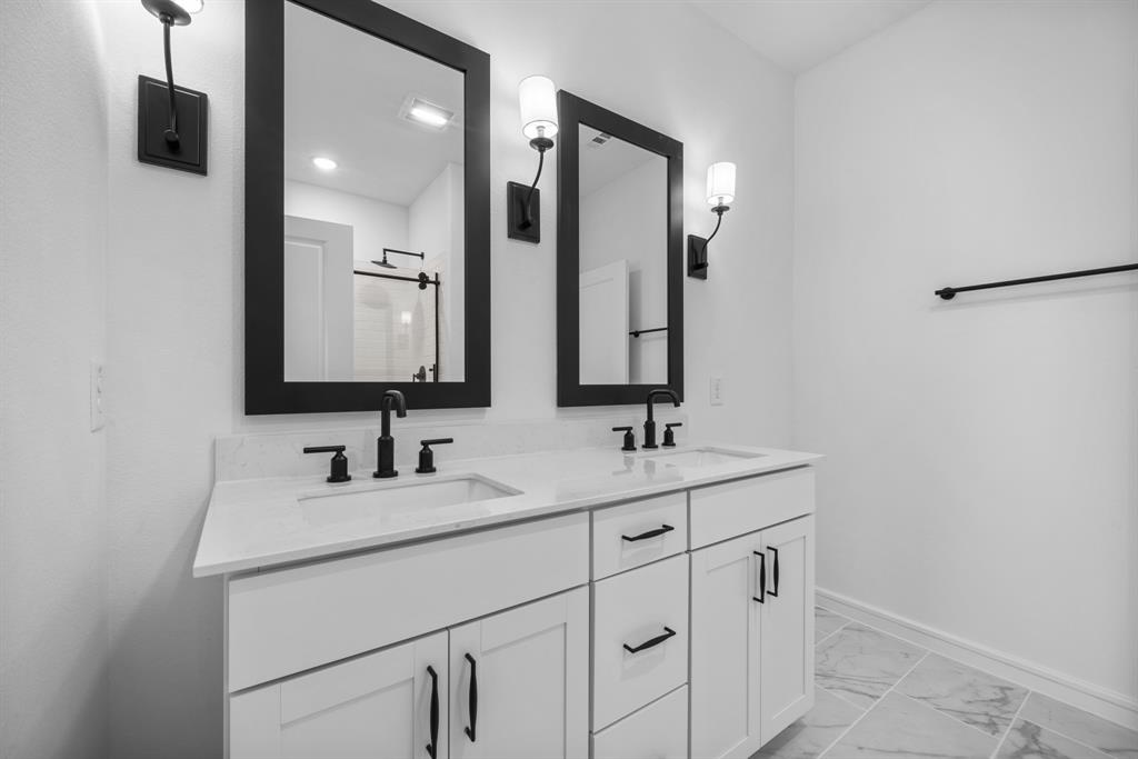 2209 Maple Ridge Drive Van Alstyne, TX 75495 - Photo 6 of 22 a bathroom with a sink and a mirror