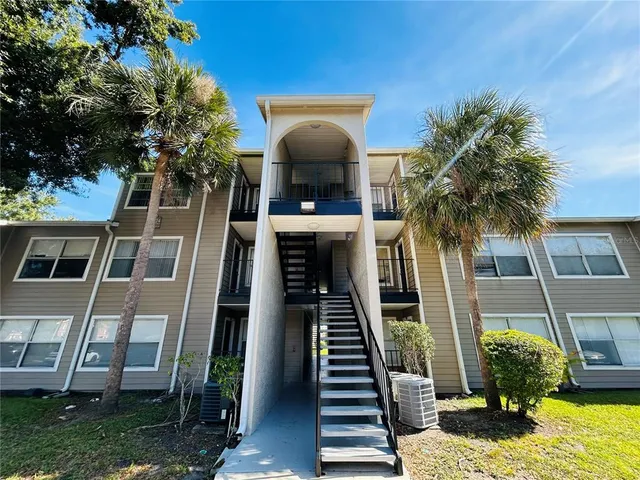 a view of a house with a small yard