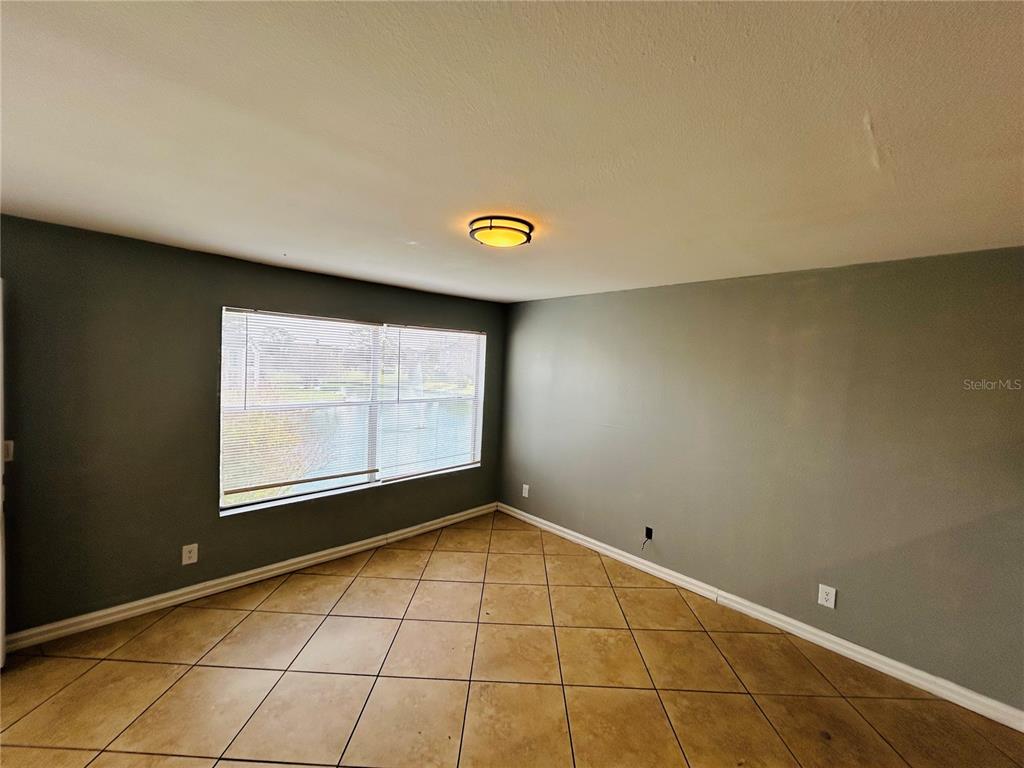 Undisclosed Address Orlando, FL 32811 - Photo 3 of 9 a view of an empty room with a window