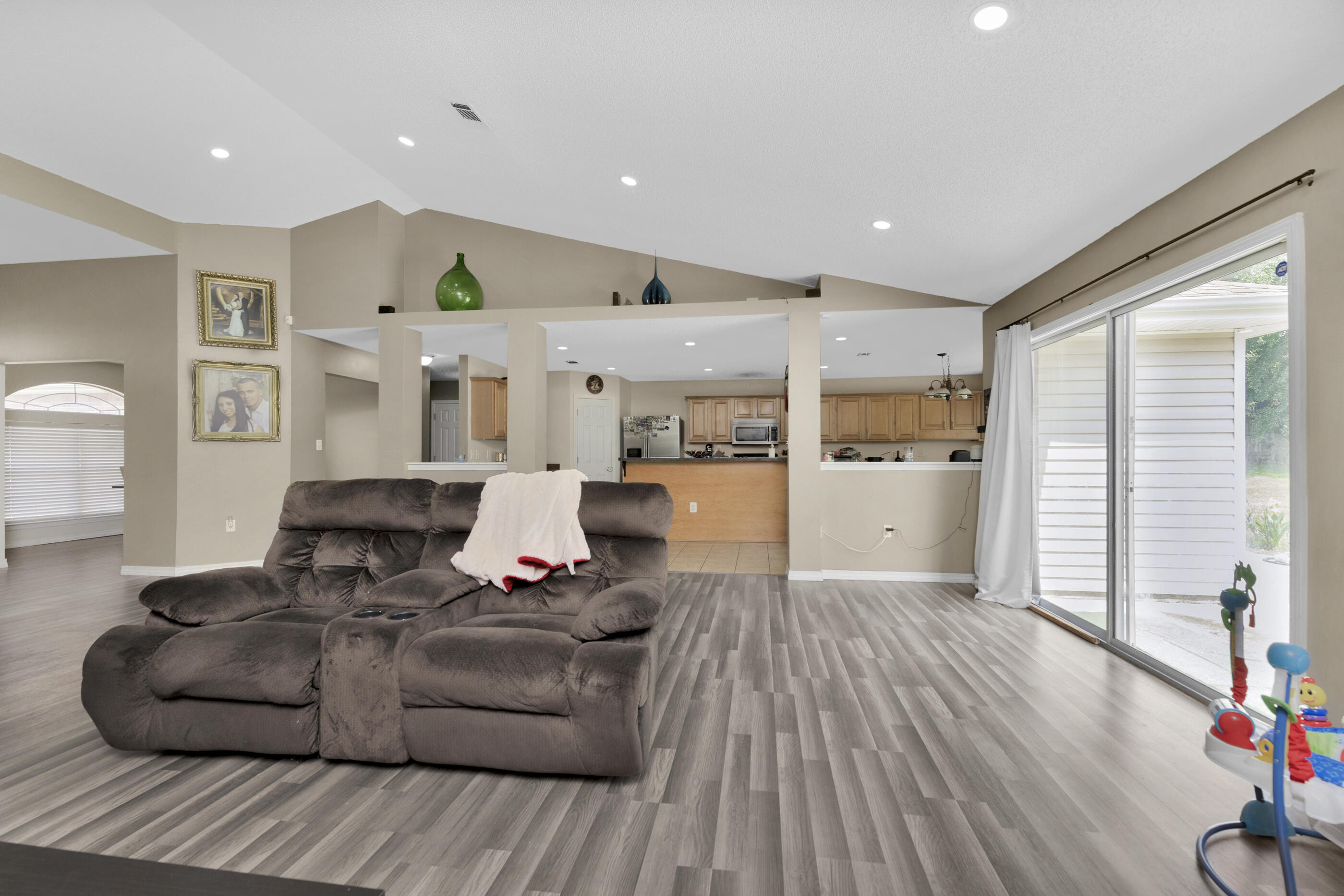 6215 Shire Lane Crestview, FL 32536 - Photo 13 of 36 a living room with furniture and wooden floor
