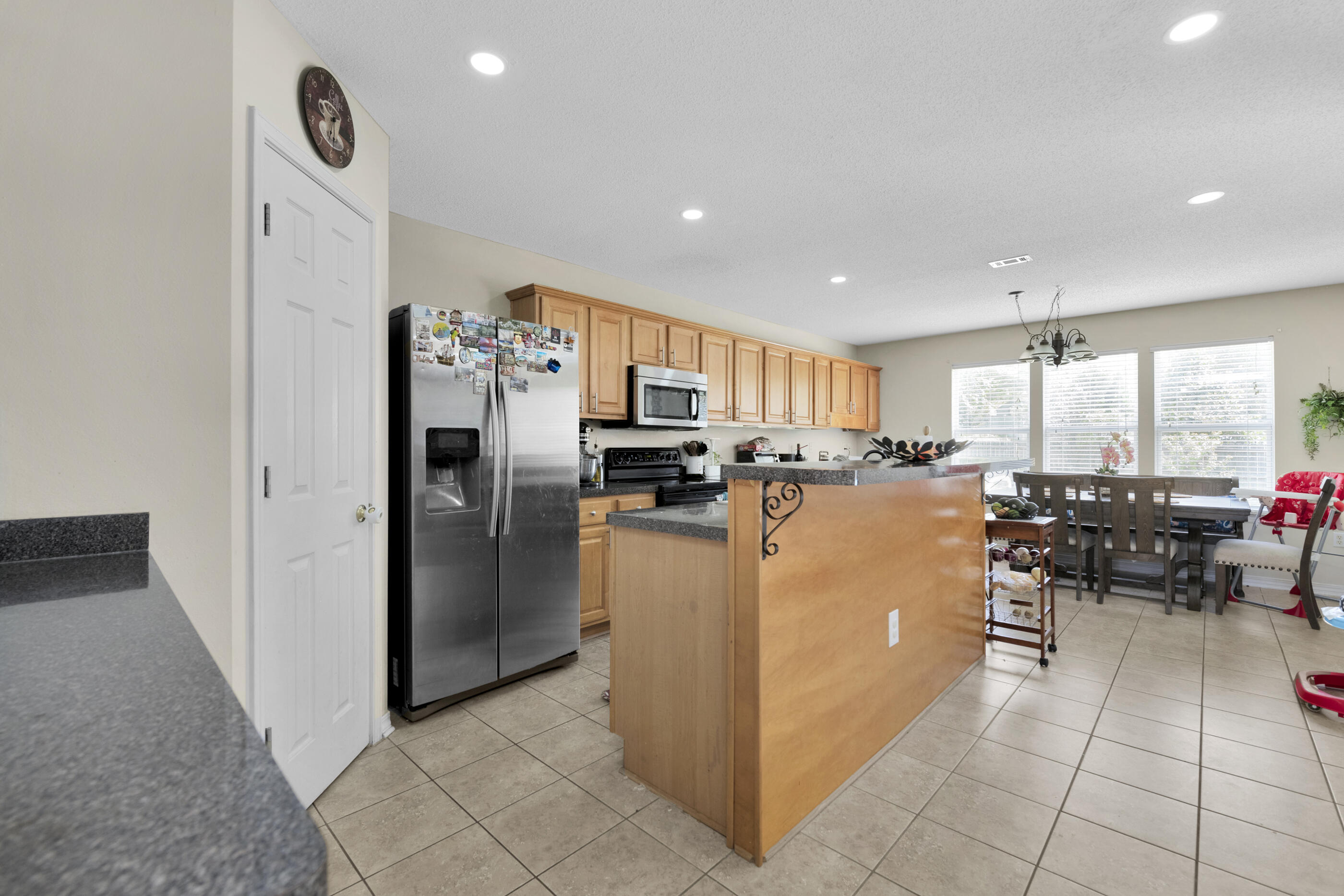6215 Shire Lane Crestview, FL 32536 - Photo 17 of 36 a kitchen with stainless steel appliances granite countertop a refrigerator and a stove top oven