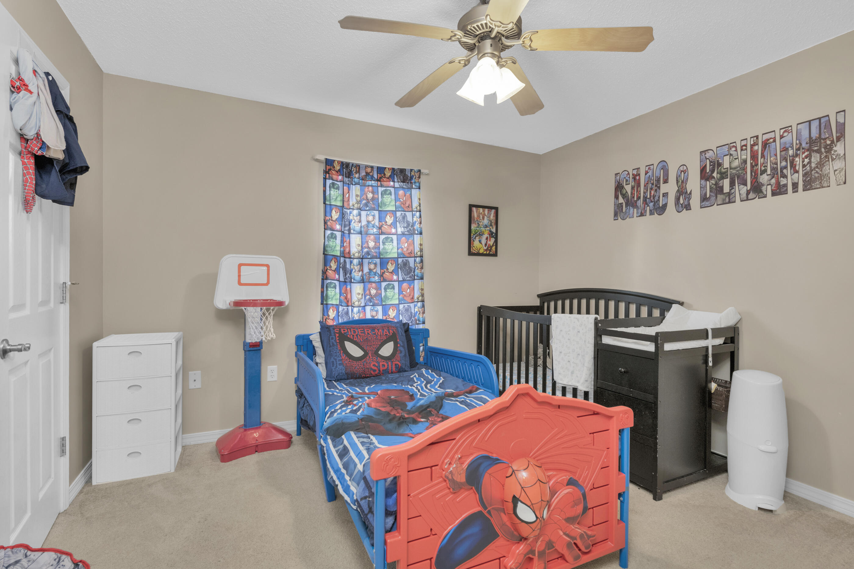 6215 Shire Lane Crestview, FL 32536 - Photo 20 of 36 a bedroom with furniture and a chandelier