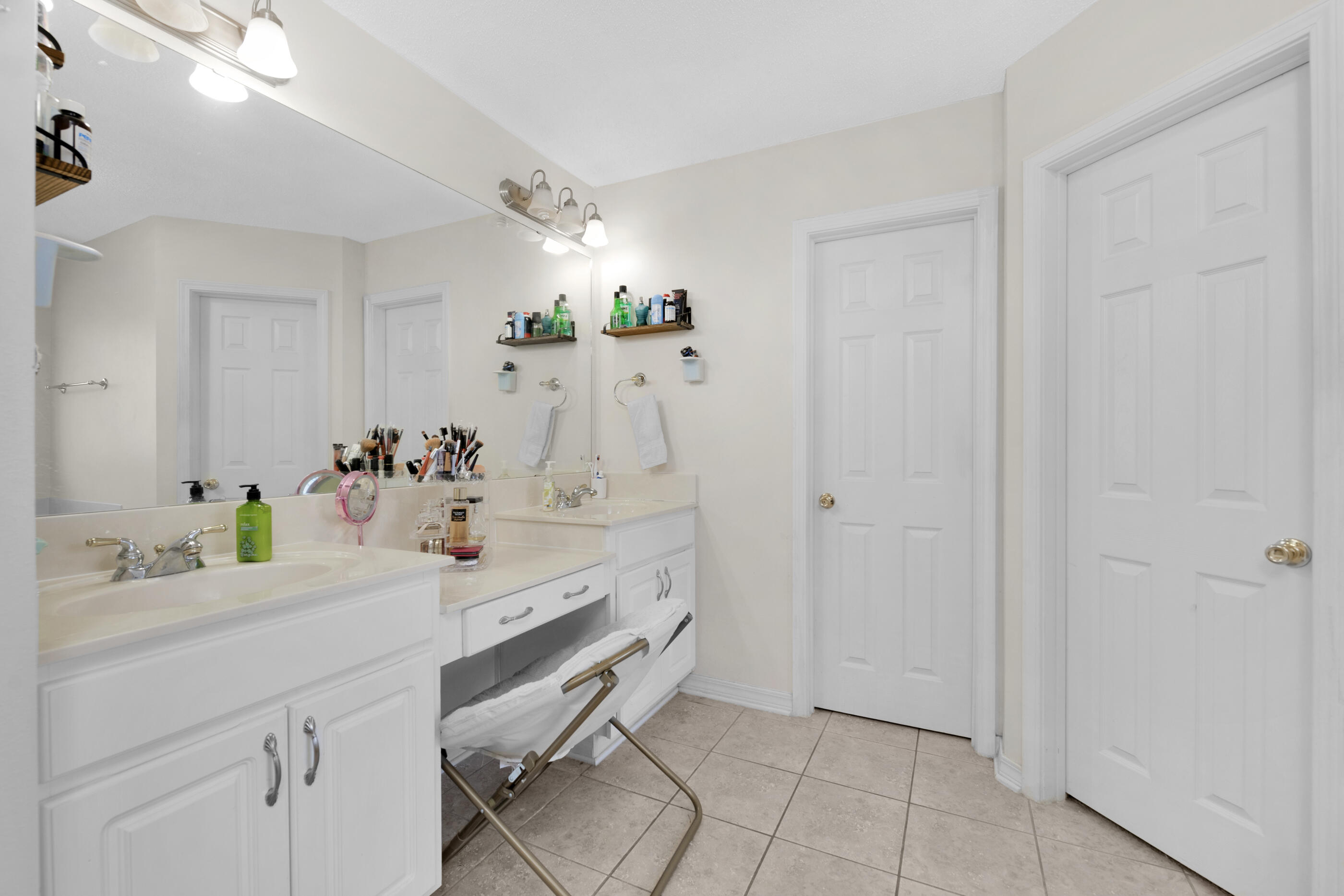 6215 Shire Lane Crestview, FL 32536 - Photo 26 of 36 a spacious bathroom with a sink and a mirror