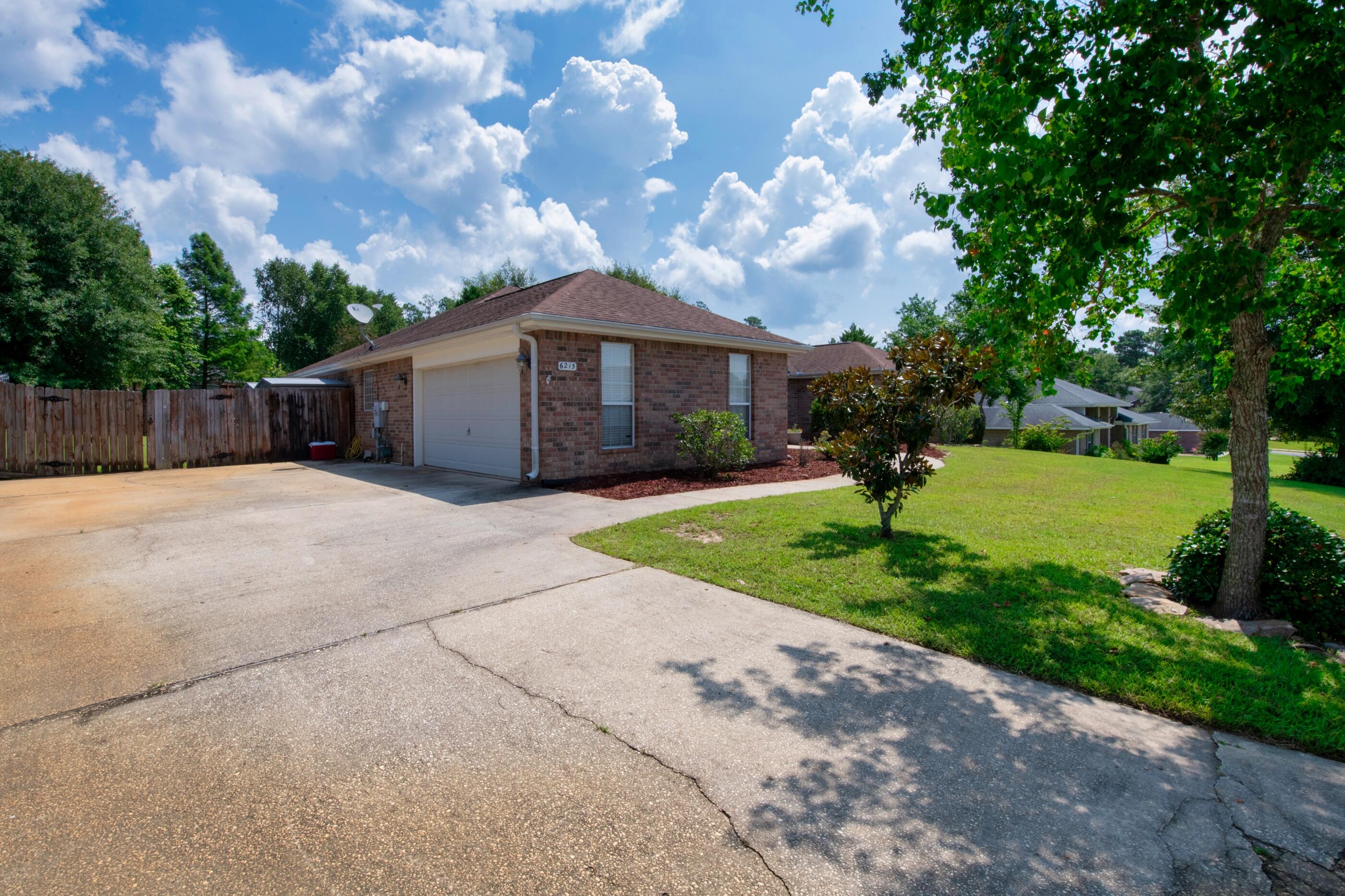 6215 Shire Lane Crestview, FL 32536 - Photo 7 of 36 a view of a house with a yard
