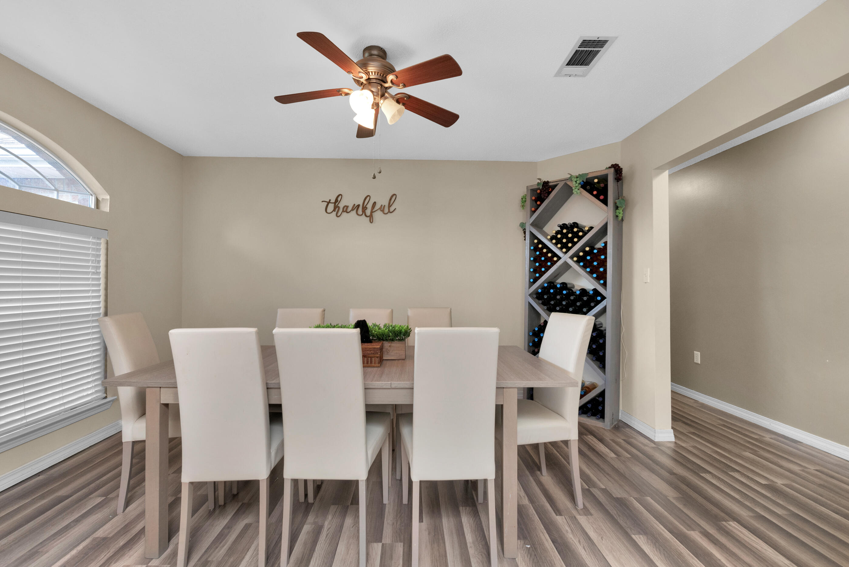 6215 Shire Lane Crestview, FL 32536 - Photo 8 of 36 a view of a dining room with furniture and wooden floor