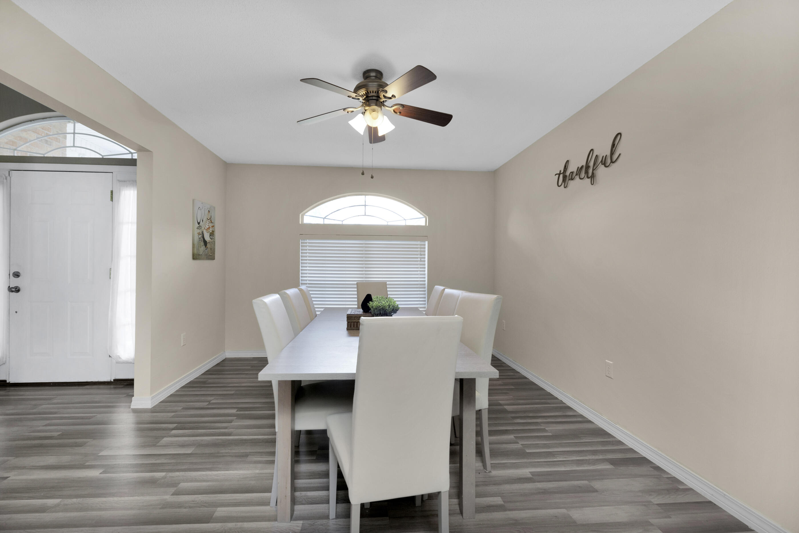 6215 Shire Lane Crestview, FL 32536 - Photo 9 of 36 a view of a dining room with furniture window and wooden floor