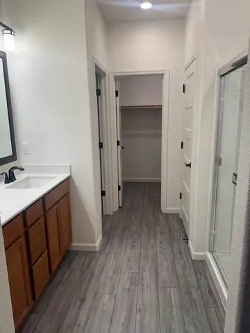 a bathroom with a sink and mirror