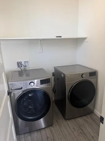 a utility room with washing machine