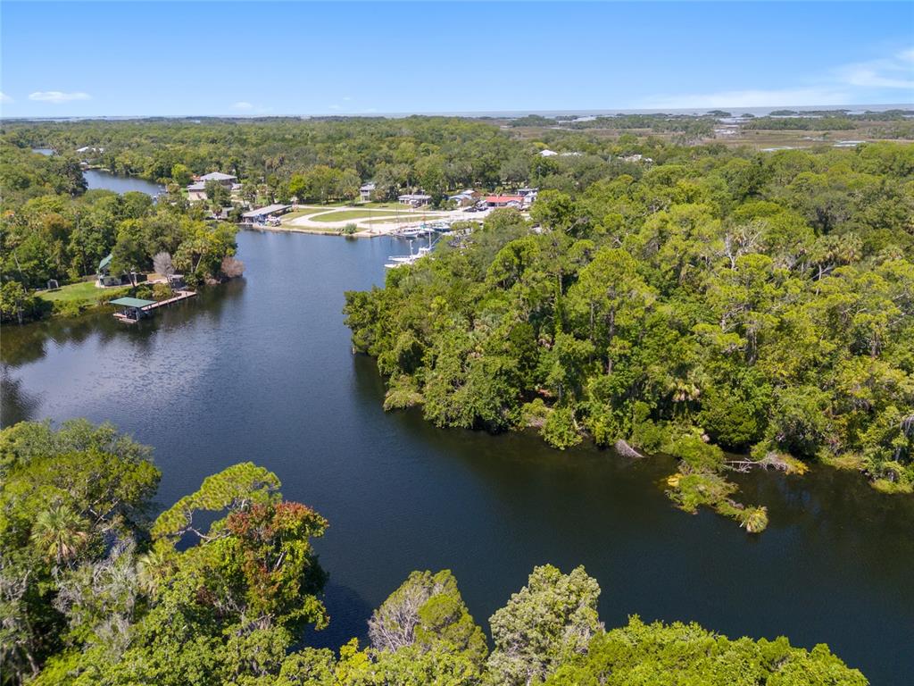 0 Hickory Avenue Yankeetown, FL 34498 - Photo 28 of 42 an aerial view of lake and residential houses with outdoor space