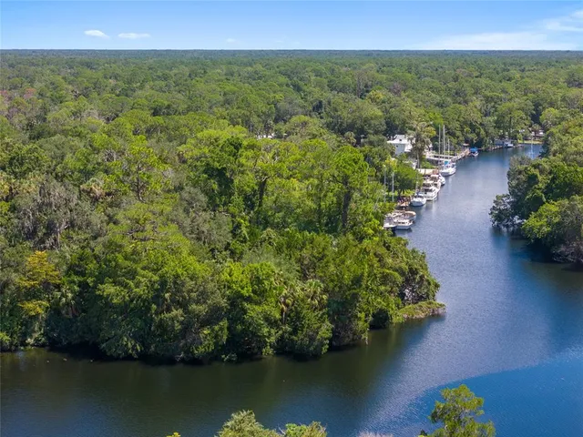a view of a house with swimming pool and sitting area