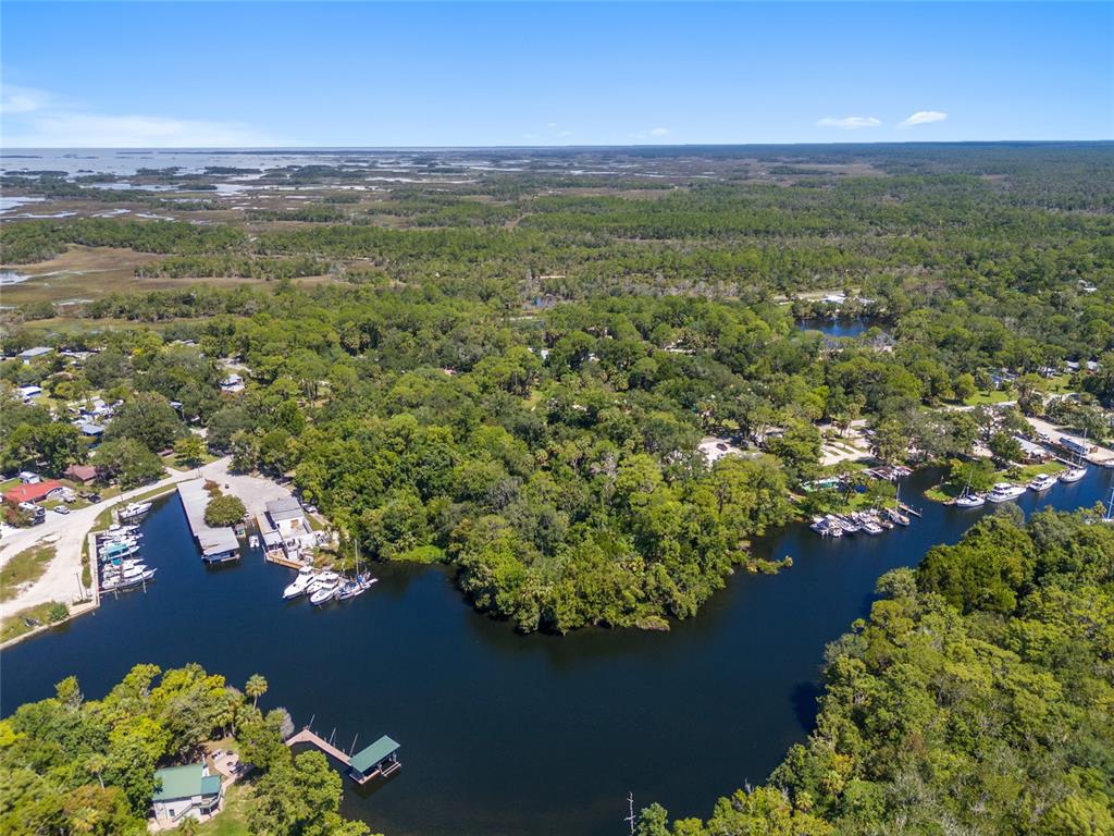0 Hickory Avenue Yankeetown, FL 34498 - Photo 35 of 42 a view of a lake with houses in the back