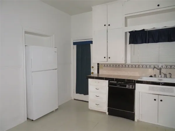 a kitchen with a sink and a stove