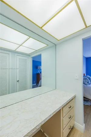 a bathroom with a sink and mirror