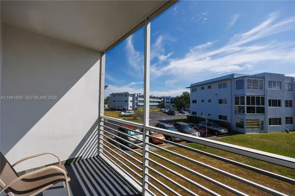 a view of a balcony with chairs