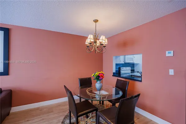 a dining room with a table and chairs