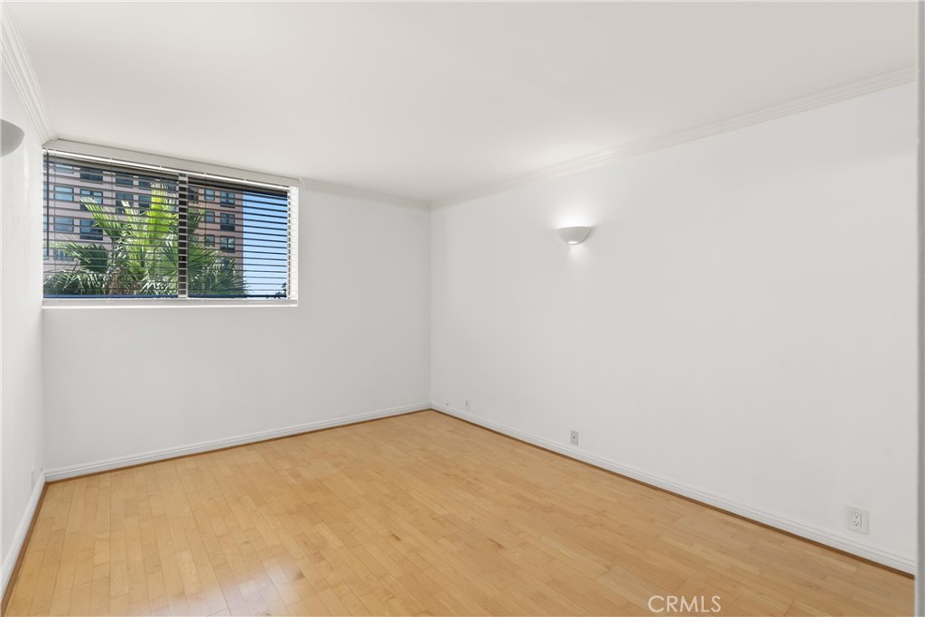 10535 Wilshire Boulevard, Unit 912 Los Angeles, CA 90024 - Photo 18 of 33 an empty room with a window