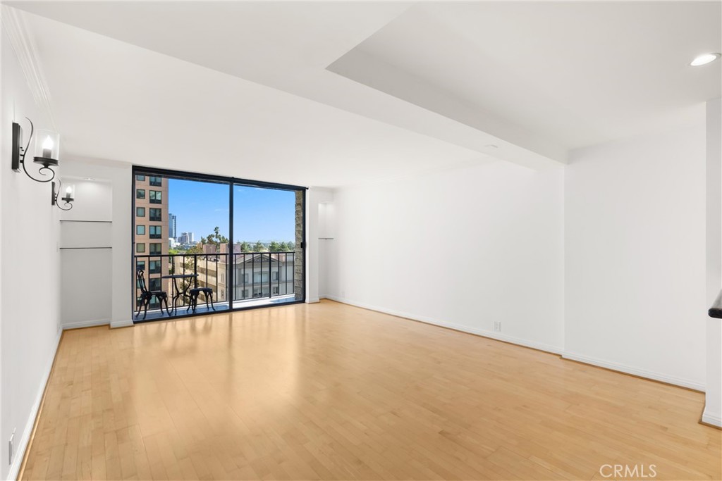 10535 Wilshire Boulevard, Unit 912 Los Angeles, CA 90024 - Photo 2 of 33 a view of a big room with wooden floor and a fireplace
