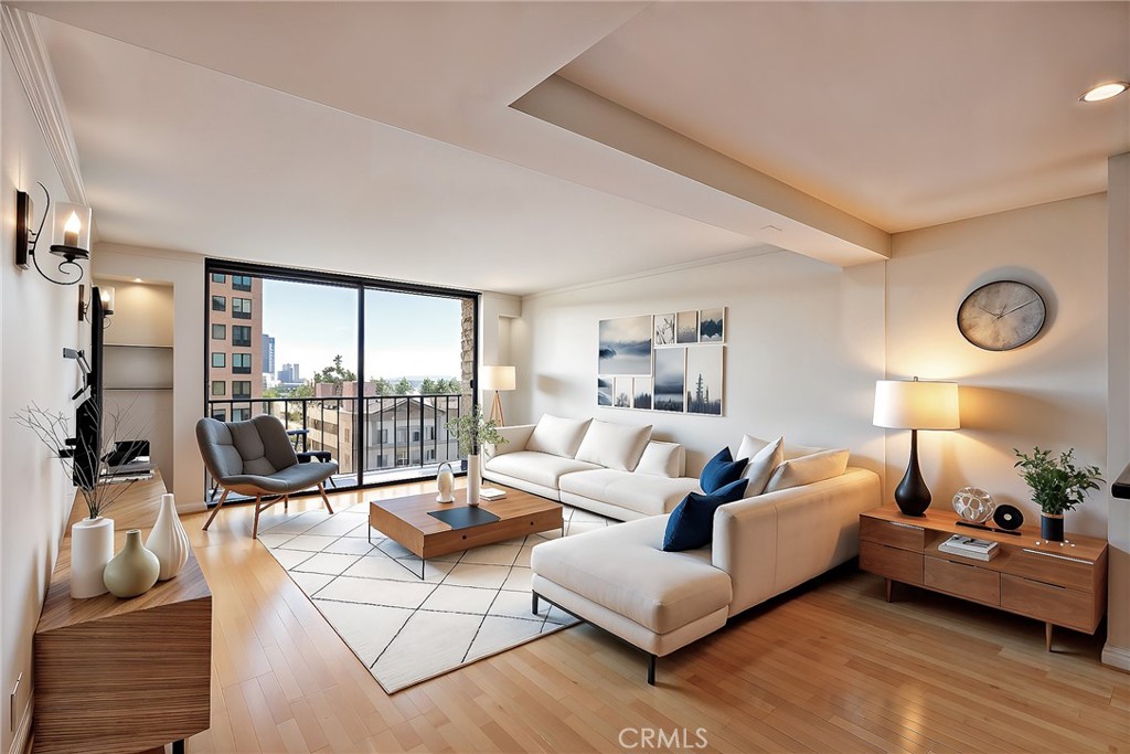 10535 Wilshire Boulevard, Unit 912 Los Angeles, CA 90024 - Photo 3 of 33 a living room with furniture and a floor to ceiling window