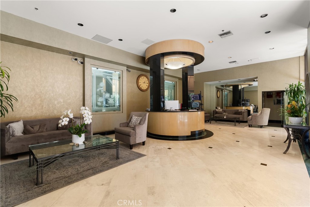 10535 Wilshire Boulevard, Unit 912 Los Angeles, CA 90024 - Photo 32 of 33 a living room with furniture and a large window