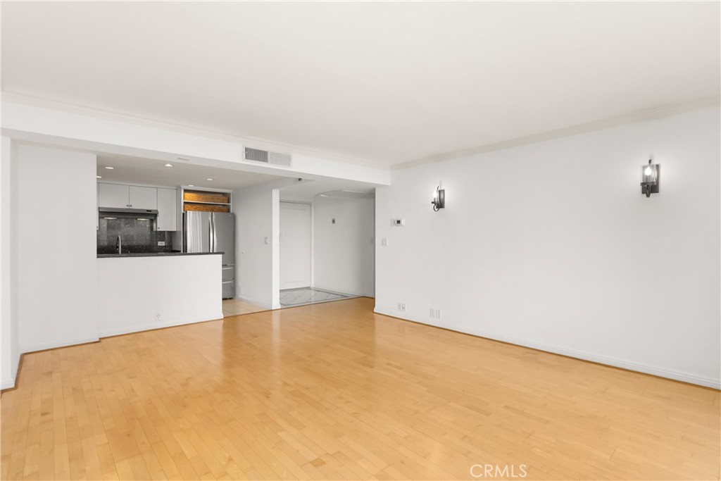 10535 Wilshire Boulevard, Unit 912 Los Angeles, CA 90024 - Photo 10 of 33 a view of an empty room with kitchen