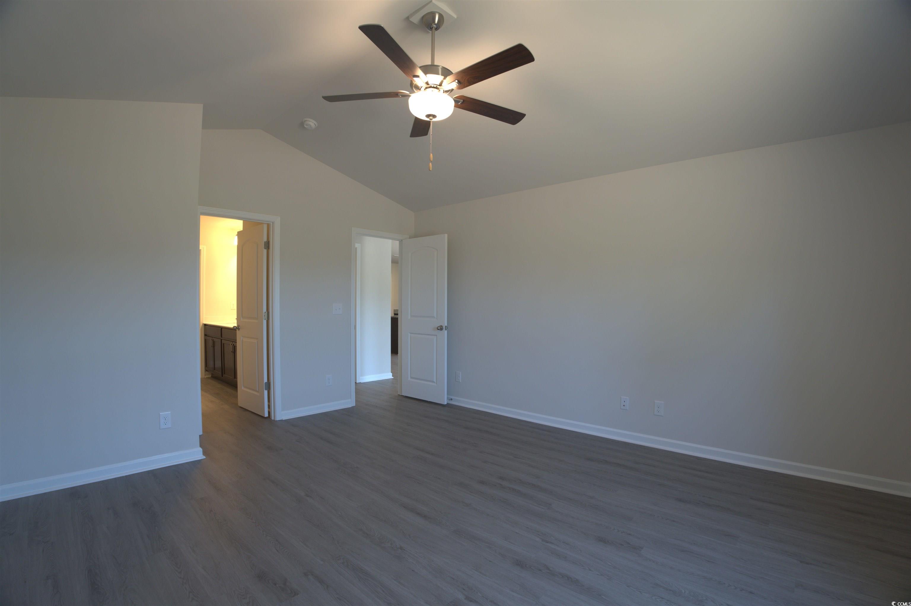 217 Kc Lane Aynor, SC 29511 - Photo 11 of 14 Bathroom with wood finished floors, a stall shower, a spacious closet, and double vanity