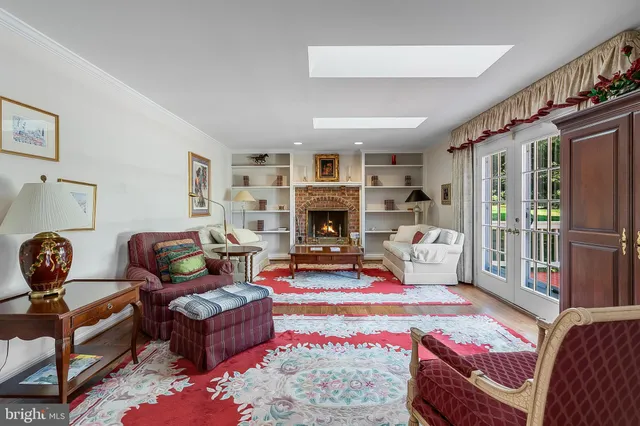 a living room with furniture fireplace and flat screen tv