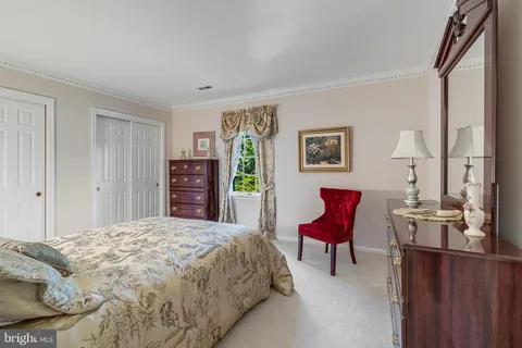 a bedroom with a bed and furniture