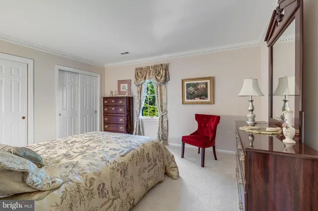 a bedroom with a bed and furniture