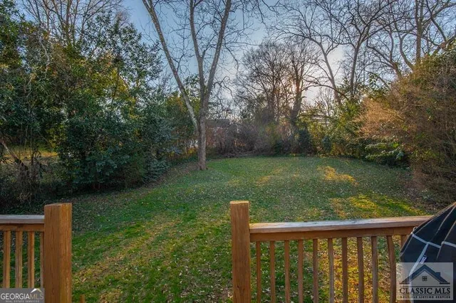 a view of a wooden deck and a lake