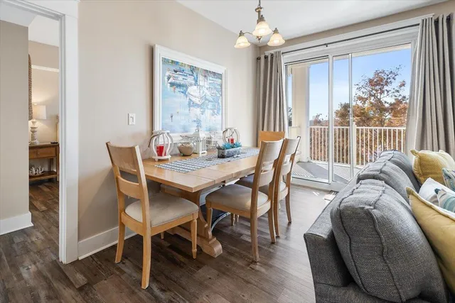 a bedroom with bed and wooden floor