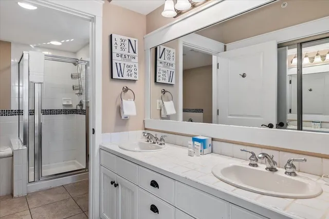 a bedroom with a bed and a night stand