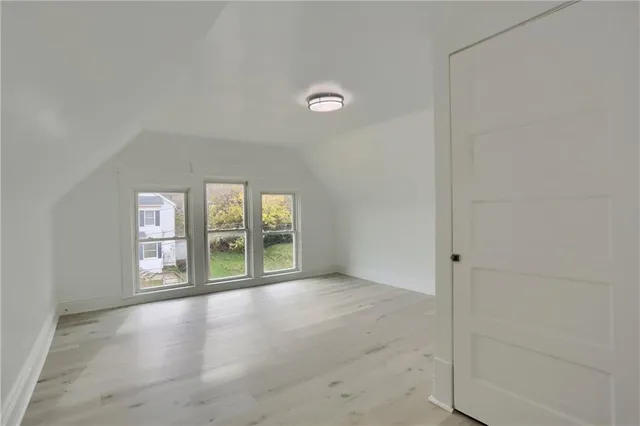 an empty room with windows and view