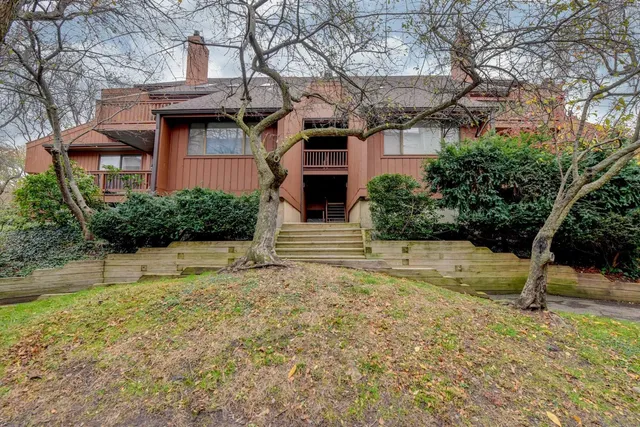 a view of parking garage with cars parked