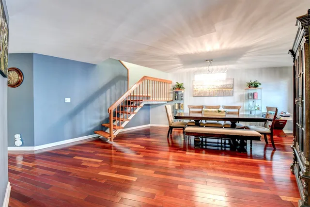 a room with lots of furniture and wooden floor