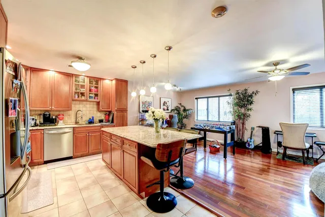 a large kitchen with lots of counter space and furniture