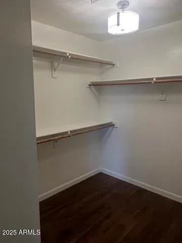 a view of an empty room with a chandelier