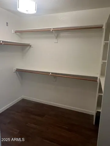 a view of an empty walk in closet