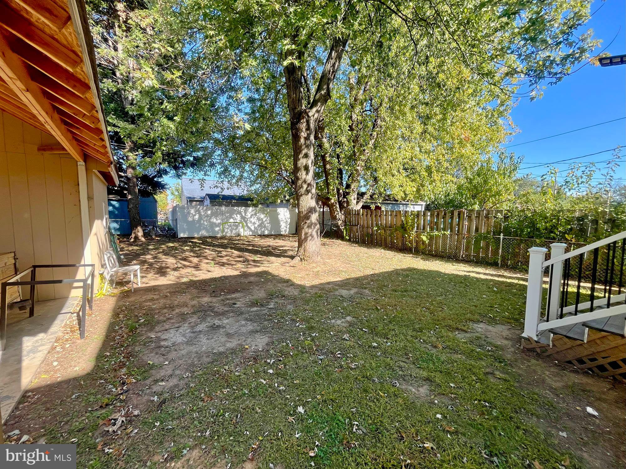 13 Plateau Road Essex, MD 21221 - Photo 4 of 9 a view of a yard with wooden fence