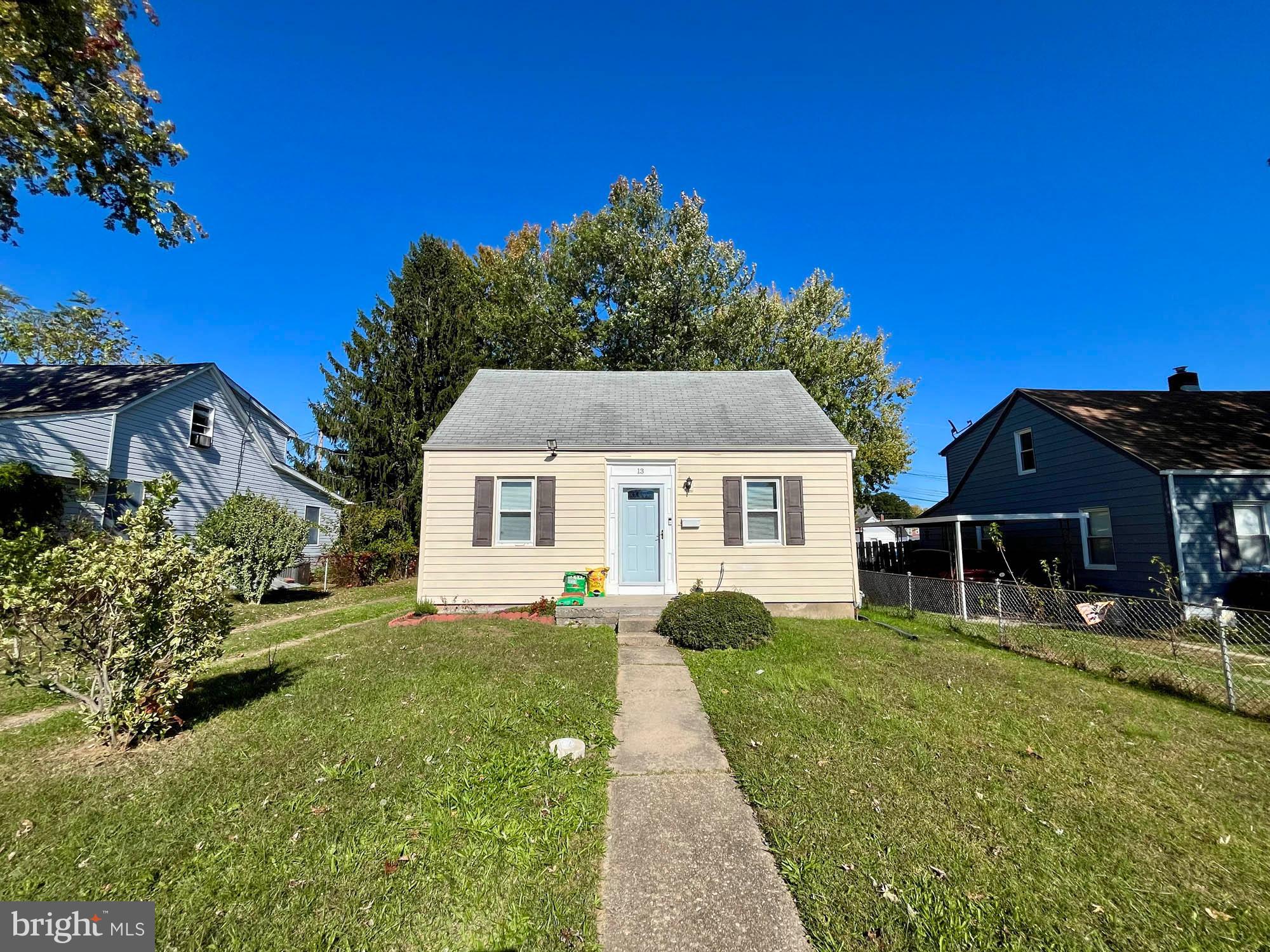 13 Plateau Road Essex, MD 21221 - Photo 7 of 9 a front view of a house with a yard