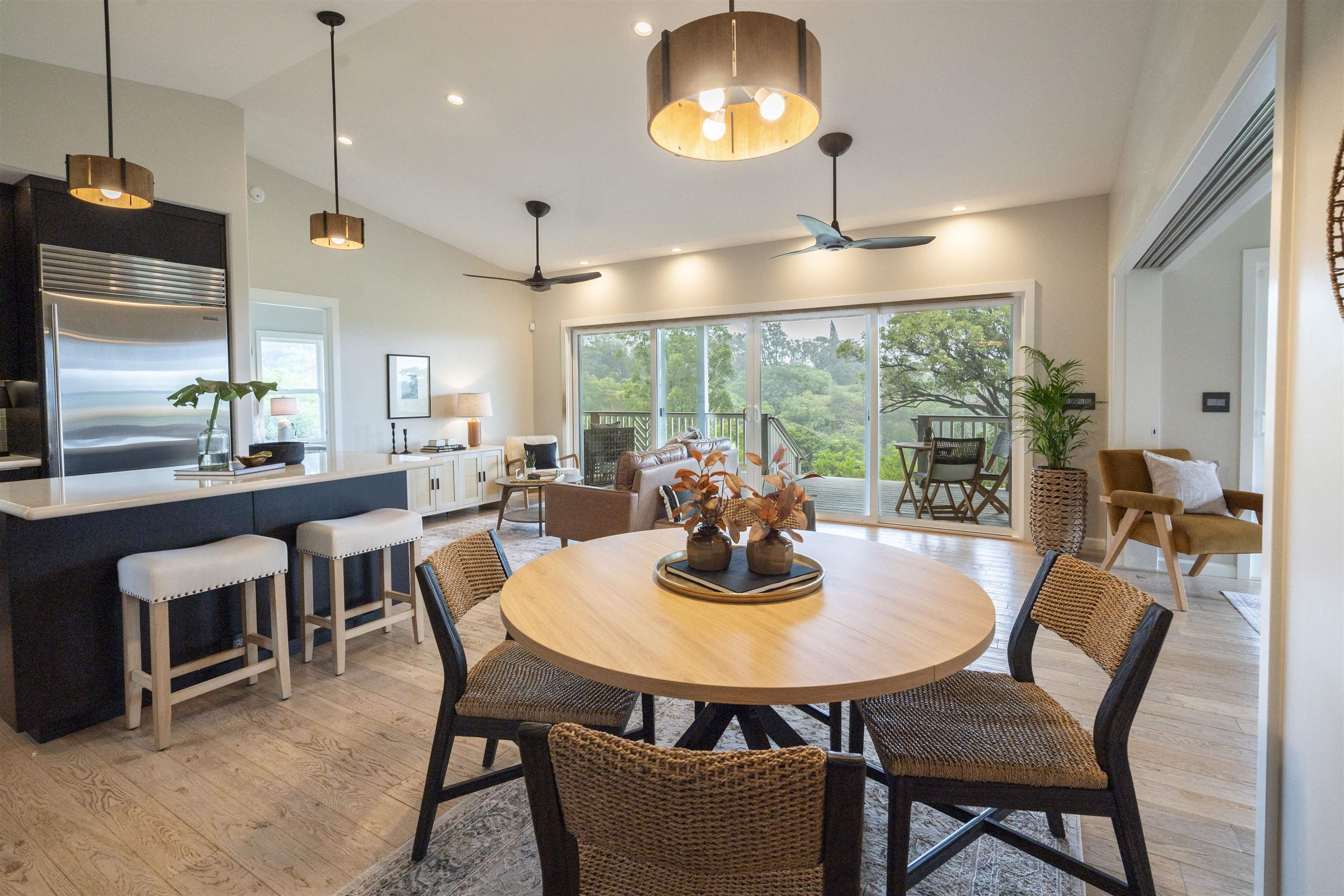 a dining room with furniture a chandelier and wooden floor