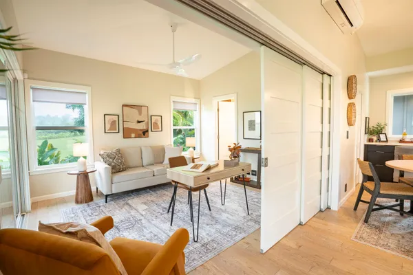 a living room with furniture and a large window