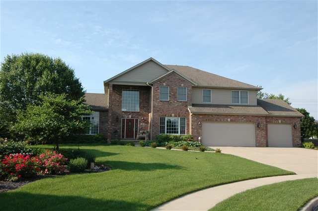 3 Strawberry Road Bloomington, IL 61704 - Photo 1 of 1 a front view of a house with a garden and plants