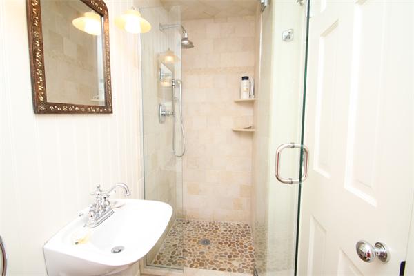 4 Mohawk Road Marblehead, MA 01945 - Photo 12 of 16 a bathroom with a shower sink and a mirror