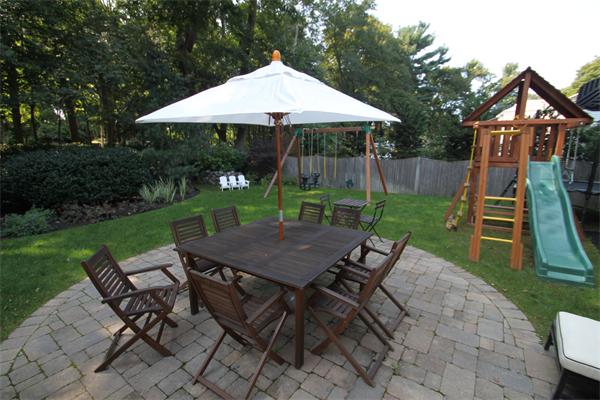 4 Mohawk Road Marblehead, MA 01945 - Photo 14 of 16 a view of a table and chairs in backyard of the house