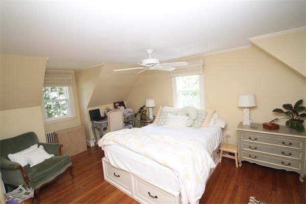 4 Mohawk Road Marblehead, MA 01945 - Photo 8 of 16 a bedroom with a bed and wooden floor