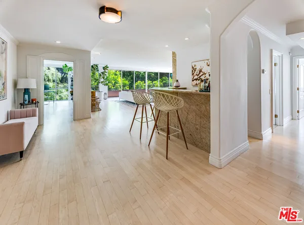 a view of a dining room with furniture and a wooden floor