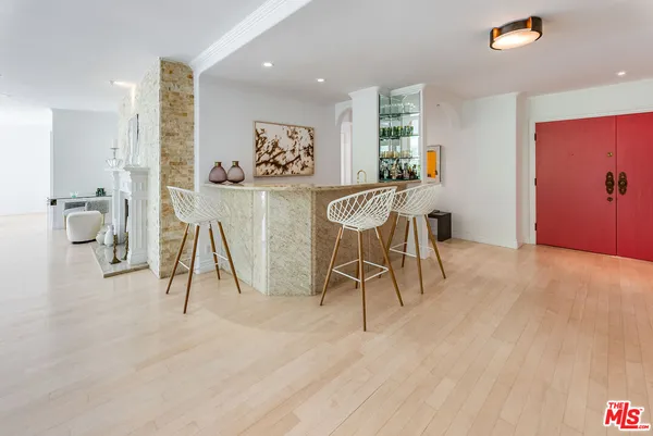 a view of a room with furniture and wooden floor